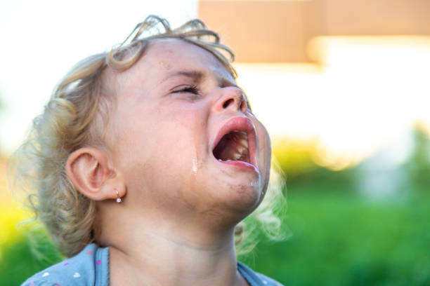 istock A child is crying on the street. Selective focus. 2167232129