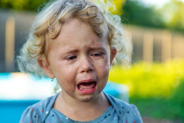 istock A child is crying on the street. Selective focus. 2167232143