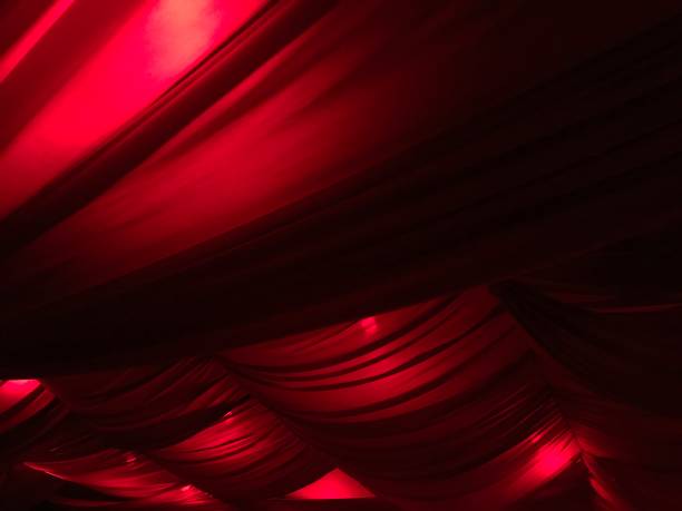 istock Red curtain in the dark room 2167232157