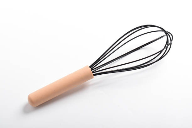 istock Whisk or egg beater. Silicone whisk with wooden handle 2167232921