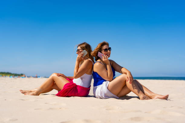 Mature women enjoying beach holiday