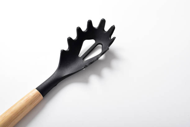 istock Close up Black silicone spoon for draining of spaghetti 2167234654