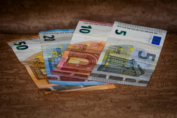 istock Fanned euro banknotes brown table 2167236894