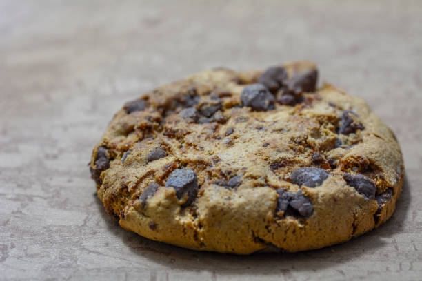 Close up of a a chocolate cookie  isolated on brown