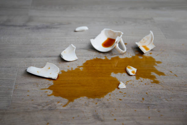 istock A broken cup of coffee fell on laminate, coffee spilled on floor. 2167245873