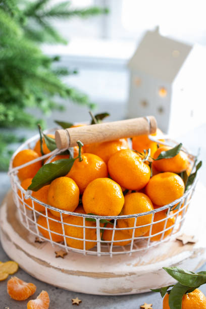 istock Tangerines in a basket in Christmas decor, selective focus 2167247260
