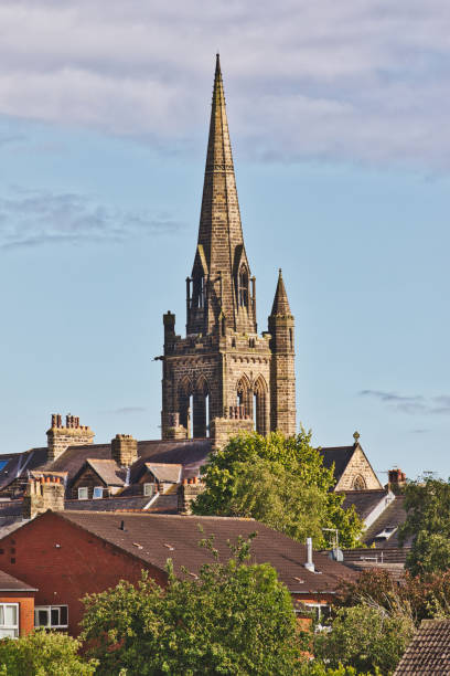 istock Church steeple towering over residential area 2167247585
