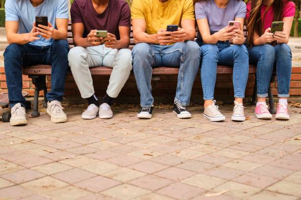 istock Unrecognizable teenagers friends using their smartphones. 2167248043