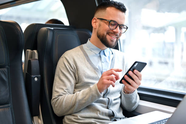 istock Young businessman working while traveling with a train 2167248291