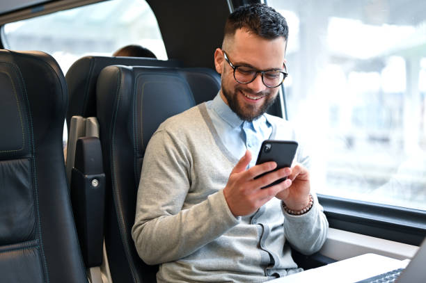 istock Young businessman working while traveling with a train 2167248292