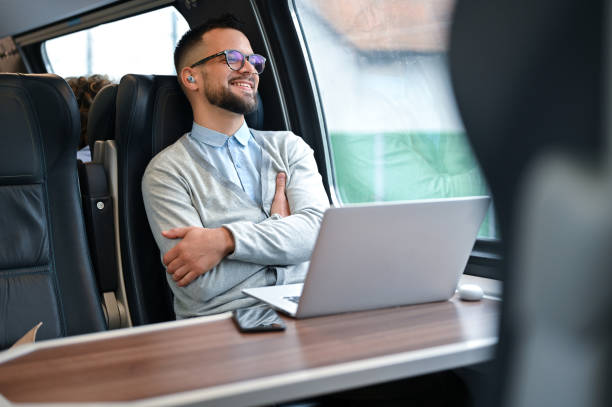 istock Young businessman working while traveling with a train 2167248353