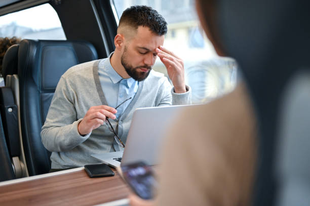 istock Young businessman working while traveling with a train 2167248379