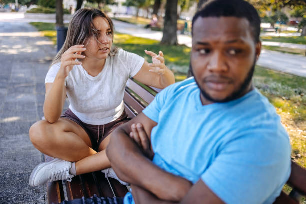 istock Young multiracial couple breaking up at the public park having relationship difficulties 2167248986