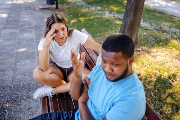 istock Young multiracial couple breaking up at the public park having relationship difficulties 2167249006