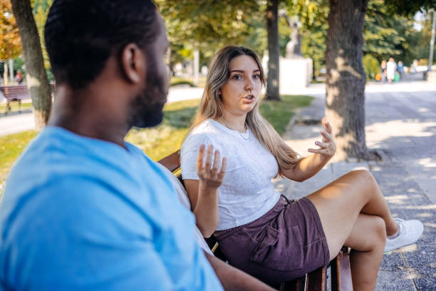 istock Young multiracial couple breaking up at the public park having relationship difficulties 2167249087