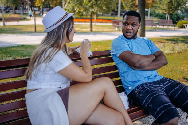 istock Young multiracial couple breaking up at the public park having relationship difficulties 2167249307