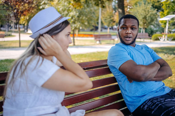 istock Young multiracial couple breaking up at the public park having relationship difficulties 2167249352