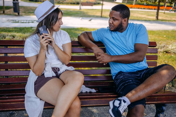 istock Young multiracial couple breaking up at the public park having relationship difficulties 2167249407