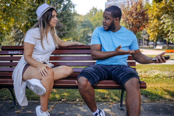 istock Young multiracial couple breaking up at the public park having relationship difficulties 2167249410