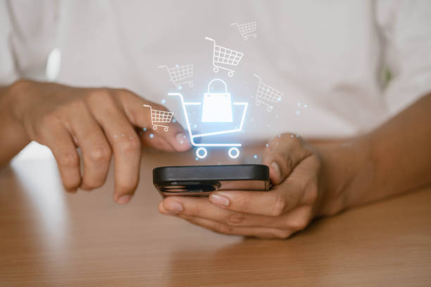 istock Online shopping, E-commerce and digital marketing concept. person using a smartphone to make an online purchase, with digital shopping icons in the background. 2167250066