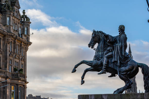 istock Equestrian statue silhouette against a cloudy sky, with historic architecture in the background in Edingburgh, Scotland. 2167250940