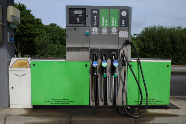 Voronezh. Russia. July 23, 2021. A female tanker in uniform fills the tank of a large white crossover at a gas station.
