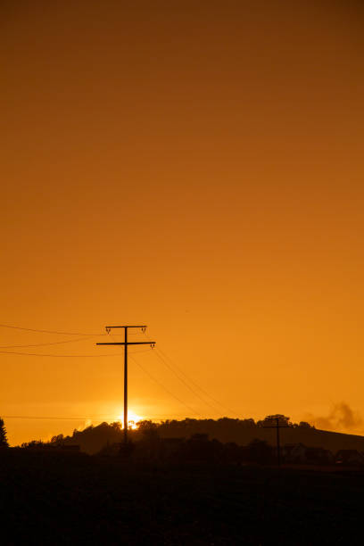Beautiful sunset with electricity pylon