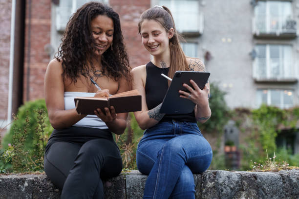 istock Two women with notebook and tablet. 2167251493