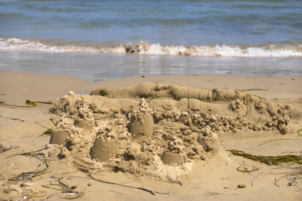Mermaid sculpted out of sand on a Devon beach