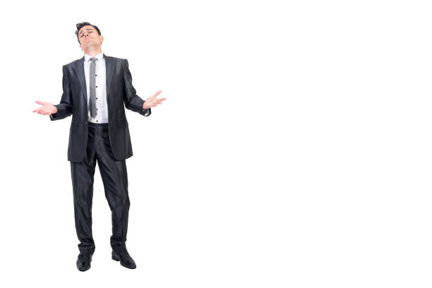 Arrogant boss in formal suit. White background. Full body of trusted businessman in elegant suit looking at camera with palms up isolated on white background in light studio arrogant-business-man stock pictures, royalty-free photos & images