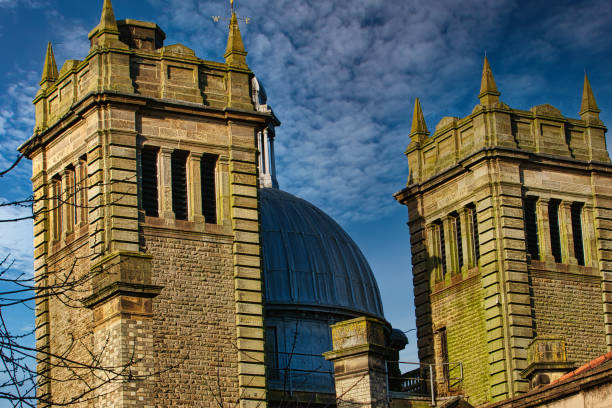 istock Twin stone towers against a blue sky with dramatic clouds, architectural detail in Harrogate, England. 2167253770