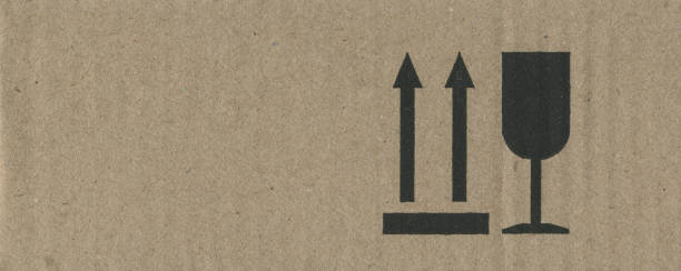 istock Cardboard Box Texture with Shipping Symbols 2167253806