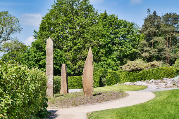 istock Stone sculptures in a landscaped garden 2167253872