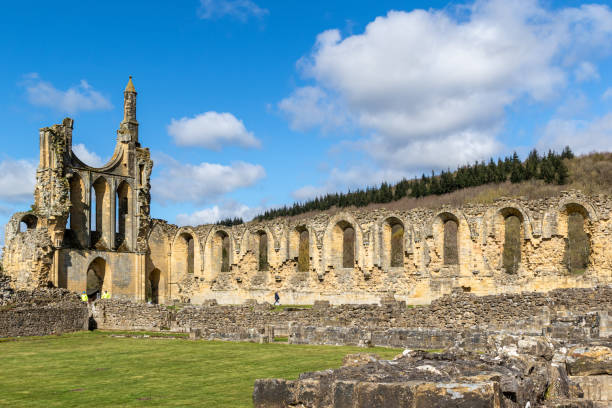 istock Ancient abbey ruins under a blue sky with clouds at Byland Abbey 2167254312