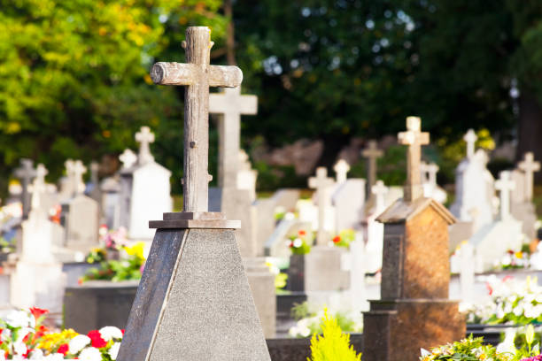 White stone cross in a graveyard in Andalsnes, Norway.