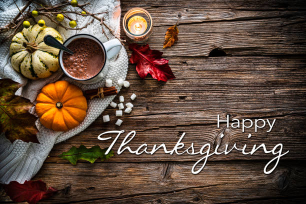 istock Hot chocolate mug with Autumn decoration on rustic table. Happy thanksgiving greeting card with copy space 2167255582