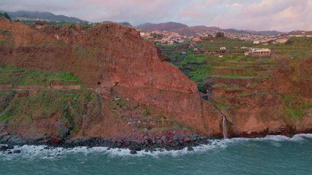 istock Beautiful sunset island cliff drone view. Tranquil untouched nature in sunlight 2167257535
