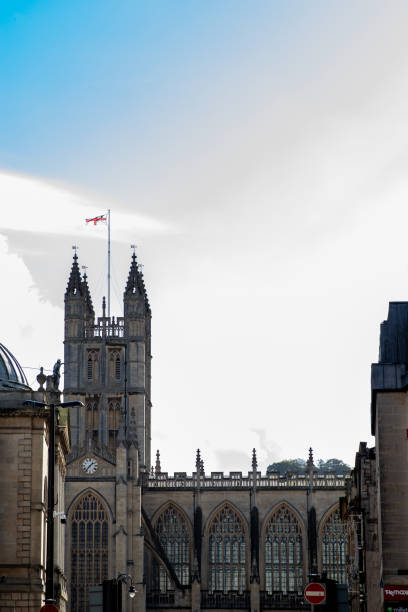 istock Gothic architecture of a historic building against a cloudy sky with space for text in Bath, England. 2167257660