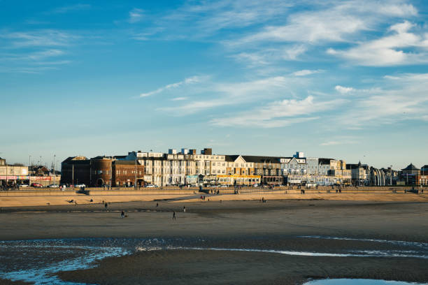 istock Coastal town skyline with buildings overlooking a sandy beach under a clear blue sky in Blackpool, England 2167260070