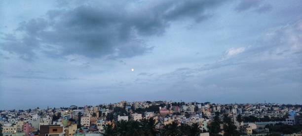 City view with moon in the evening