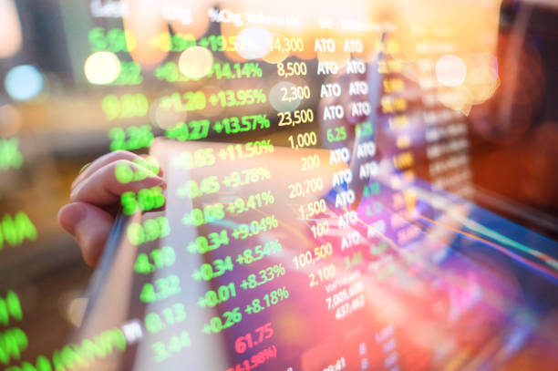 istock close-up of a hand using a digital tablet with AI-enhanced financial graphs, representing the influence of AI in driving financial growth. 2167268304