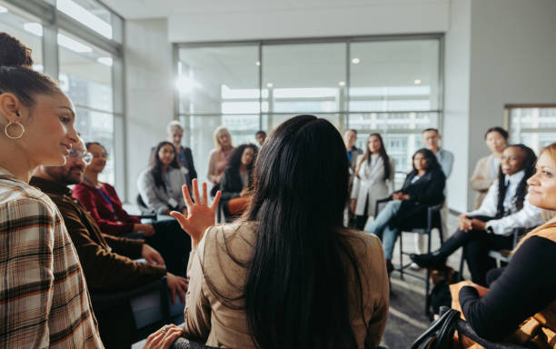 istock Collaborative team meeting: Coworkers engaged in discussion in a modern office 2167270103