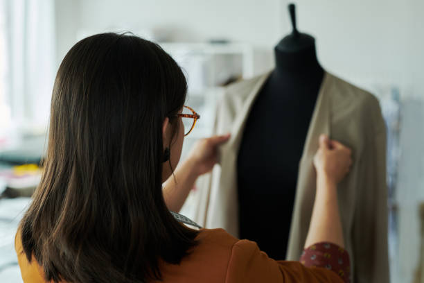 istock Rear view of young female tailor 2167270124