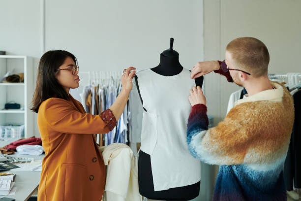 istock Putting unfinished dress on mannequin 2167270130