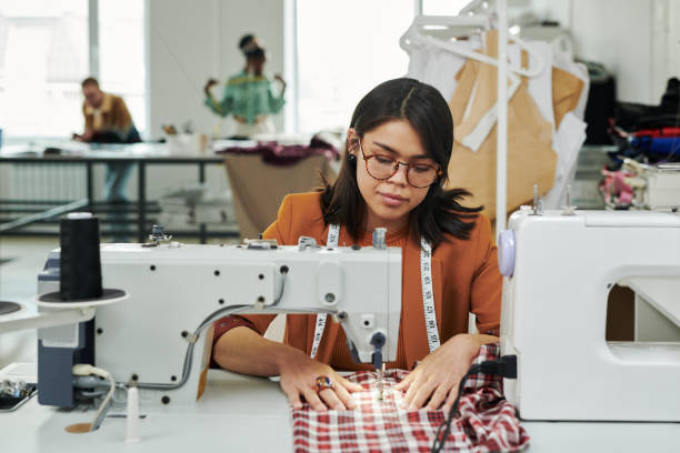 istock Young seamstress creating new attire 2167270191