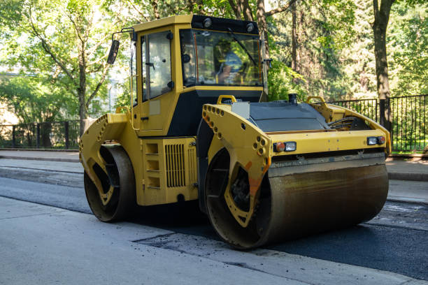 Roller for laying fresh hot asphalt on the road. Road construction equipment. Roller for laying fresh hot asphalt on the road, city street. Road construction equipment. flattening stock pictures, royalty-free photos & images