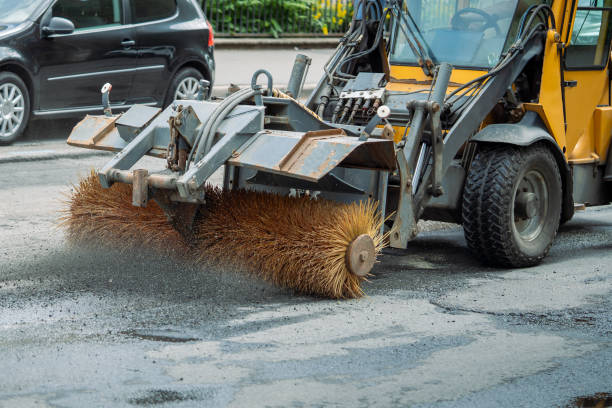 istock Road construction, tractor brushes the crushed stone from old asphalt before laying new 2167274038