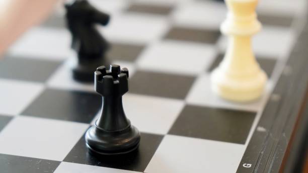istock chess piece on a chessboard in an office with 2167274811