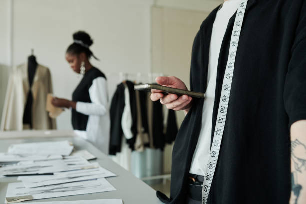 istock Male fashion designer using mobile phone 2167277946