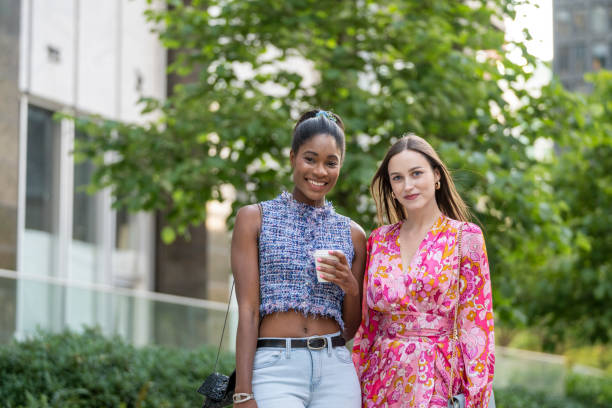 Young women walk on paved pathway, Vancouver